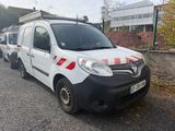a white van that is parked on the side of the road