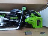 a box with a green and black electric tool inside of it