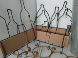 a display of wine bottles and wine glasses on a shelf