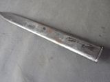a knife that is laying on a table