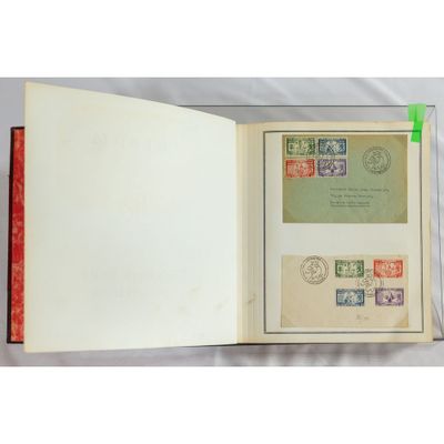 an open book with stamps and a picture of a man on the cover