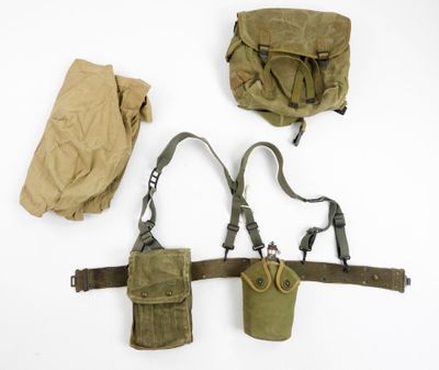 a bag and a pair of scissors hanging on a wall