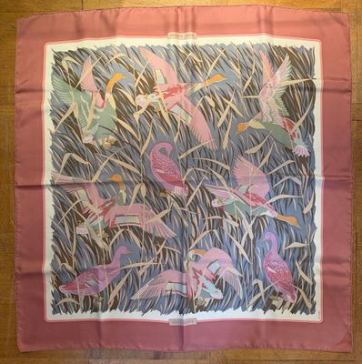 a picture of a pink scarf with pink birds on it