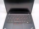 a laptop with a keyboard on it sitting on a table