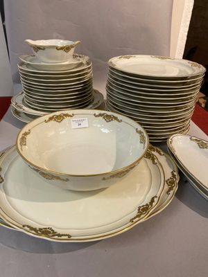 a lot of plates and bowls sitting on a table