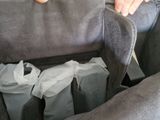 a person holding a bag of coffee in their lap