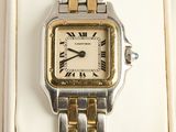 une image représentant une montre en argent et en or ornée de chiffres romains