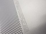 an image of a close up of a metal sheet with holes on it