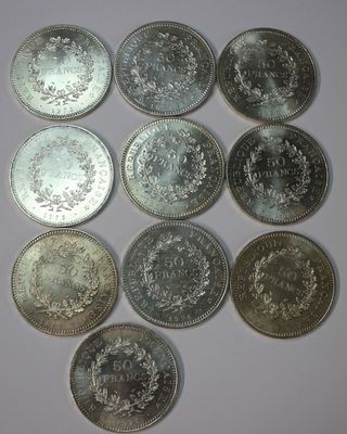 a close up of a bunch of coins sitting on top of a table