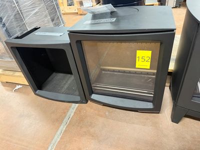 two ovens sitting next to each other on the floor