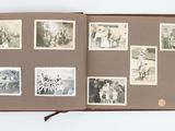 an open book with pictures of people and animals on it