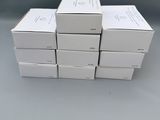 six boxes of white boxes stacked on top of each other on a table