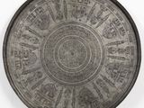 an image of a metal plate with designs on it
