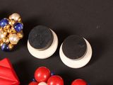 a black table with some red, white, and blue items on it