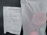 a plastic bag with a pink object inside of it