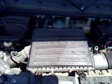 a picture of a car ' s engine with the hood open