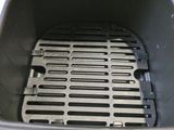 a grill with a grill grate inside of it