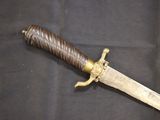 a knife that is laying on a black cloth