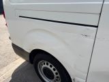 a white van that is parked on the side of the street