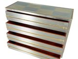 a silver chest of drawers with a checkered pattern on it