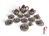 a lot of small cups and saucers on the table