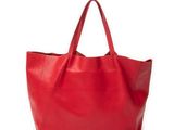 a red leather tote bag on a white background