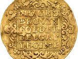 an old gold coin with ornate writing on it
