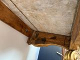 a wooden shelf with a clock on top of it