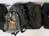 several pieces of luggage are lined up on a white surface