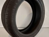 a close up of a tire on a white surface with a white background