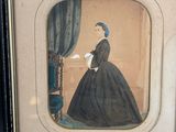 a picture of a woman in a black dress in a picture frame
