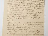 a letter written in black ink on a piece of paper