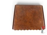 an old brown leather book with a red handle on a white background