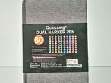 a close up of a notebook with a pen on top of it