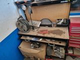 a workbench with tools on it in a garage
