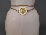 a close up of a mannequin torso with a bracelet on it