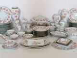 many different types of plates and bowls on the table