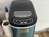 an image of a small ice cream maker on a table