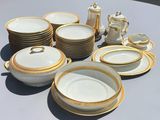 a lot of plates and cups on the table