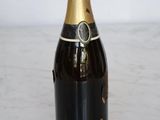 an image of a bottle of champagne sitting on a table