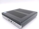a close up of a small computer on a white surface