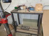 a workbench with tools on it in a garage