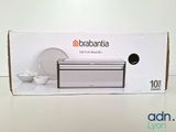 a white box with a white plate and a white bowl on it