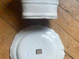 pair of white porcelain pedestals on wooden floor with wood flooring