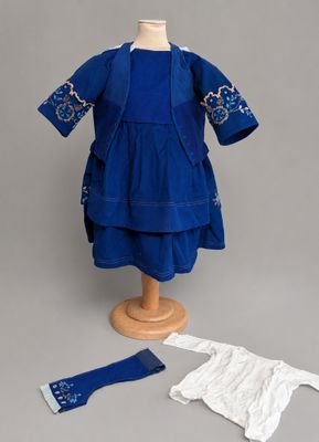 an image of a blue dress and a white shirt on a mannequin