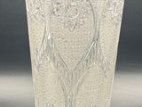 a clear glass vase with a design on it