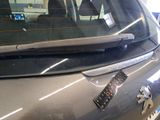 a sticker on the back of a car that has a remote control attached to it