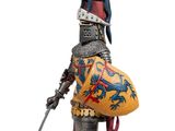 statue of a knight in full armor with a sword and shield