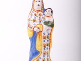 figurine of the virgin mary and child jesus on a blue and yellow base
