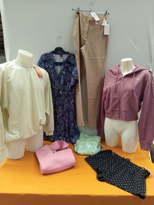 a display of clothing on a table in a room